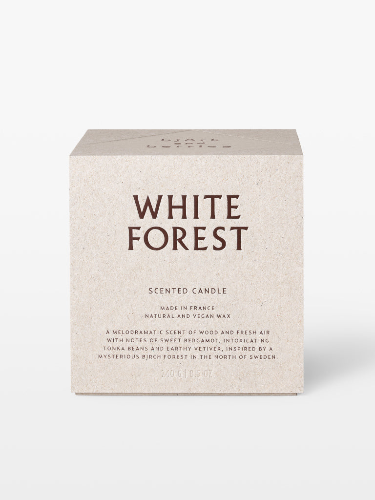 Björk and Berries scented candle white forest in a beige textured cardboard box standing against a white background.
