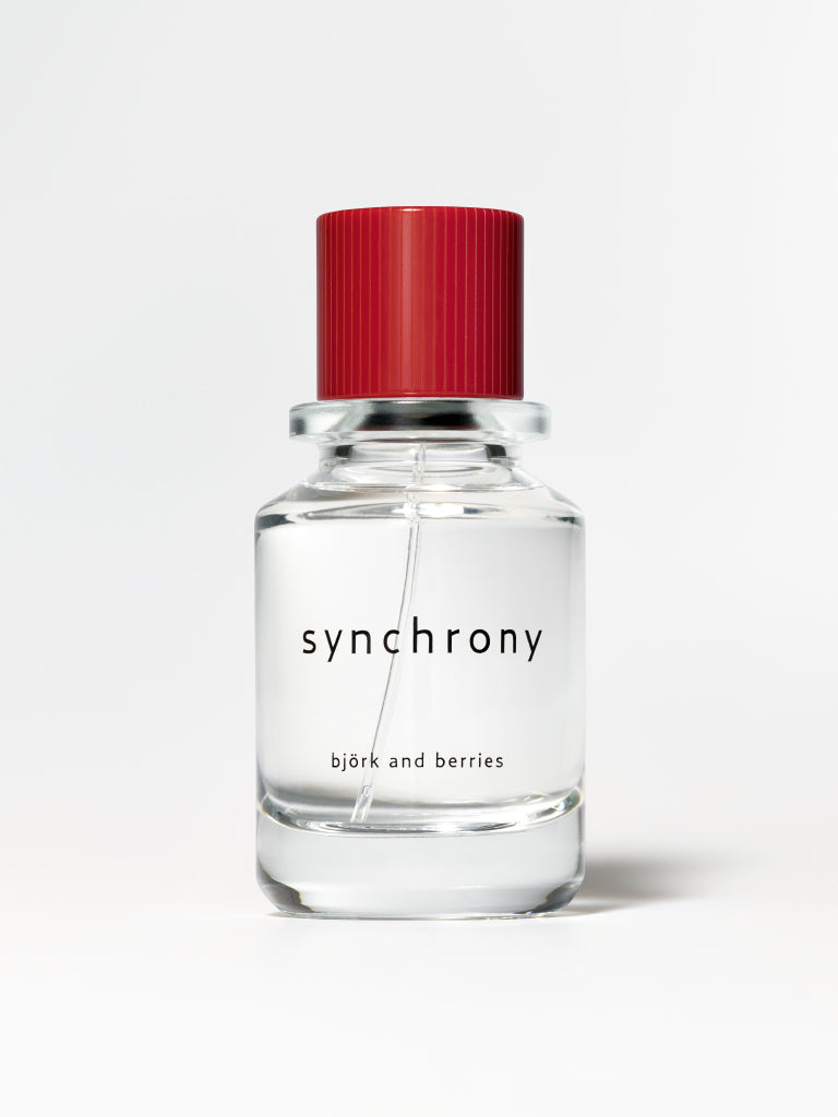 Björk and berries synchrony eau de perfume standing against a white background. 
