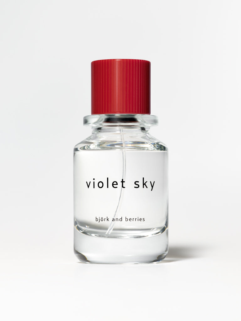 Björk and berries violet sky eau de perfume standing against a white background. 