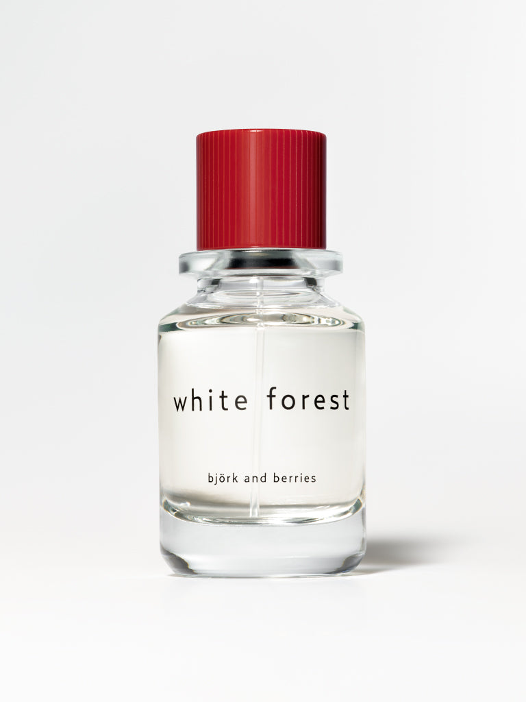Björk and berries white forest eau de perfume, standing against a white background. 